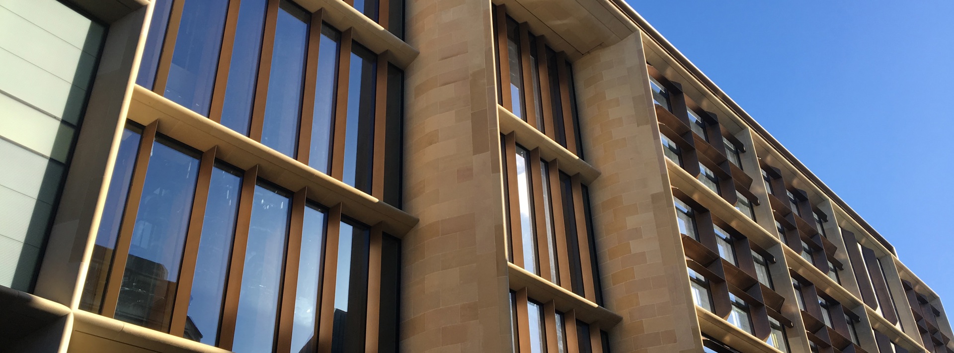 The Bloomeberg building with glass windows along the front