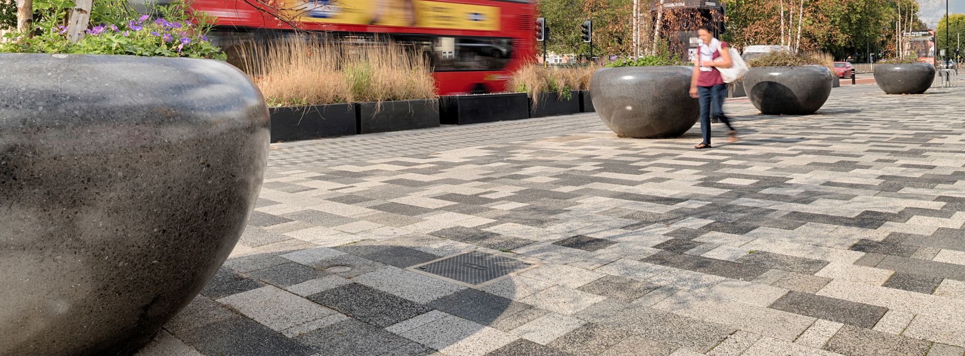 Giove planters along a pathway