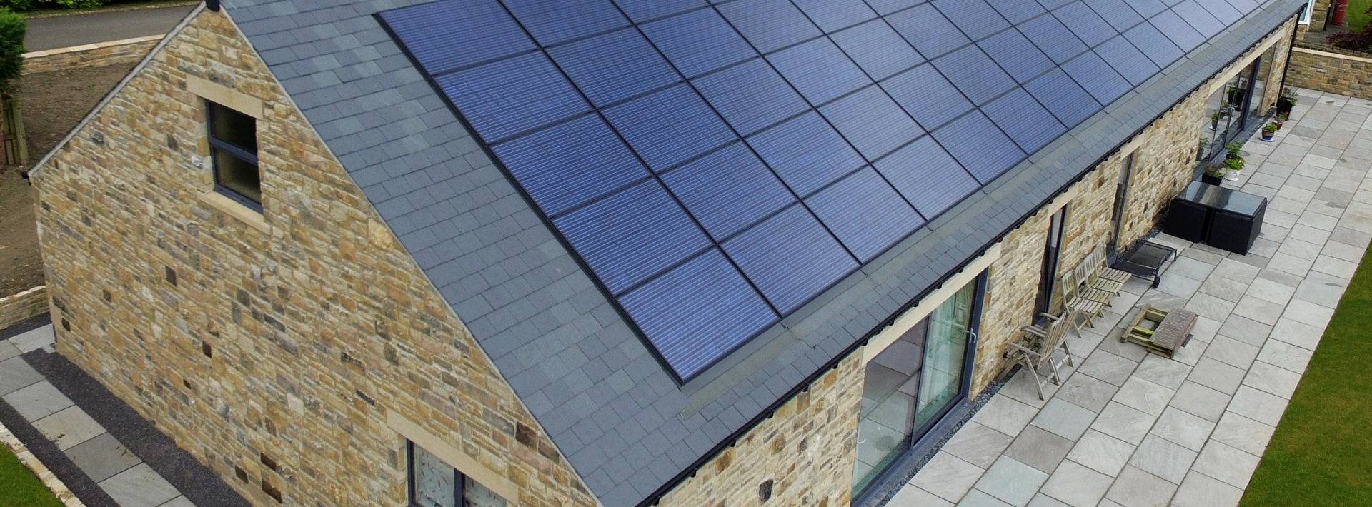 Viridian solar panels on top of a house