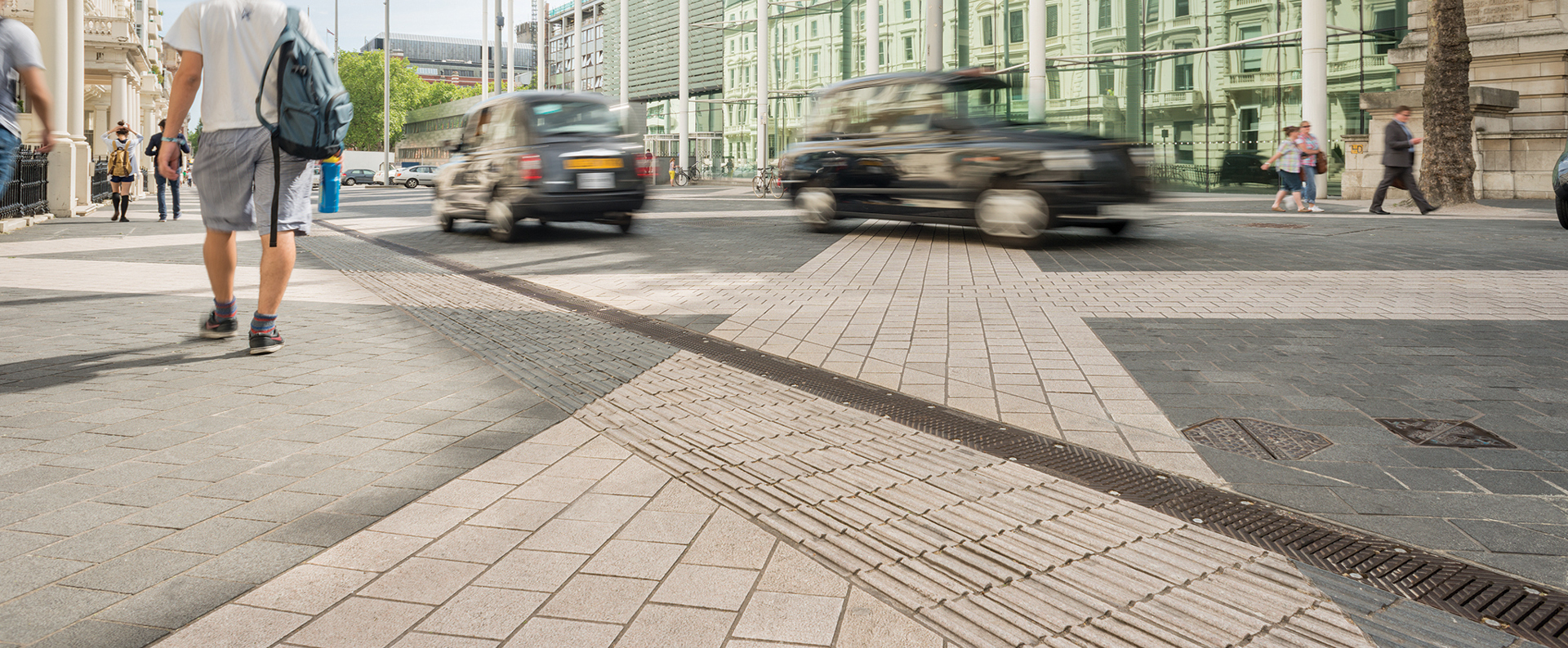 Members of the public walking down a busy street in London