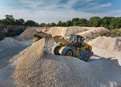 A digger on top of aggregates