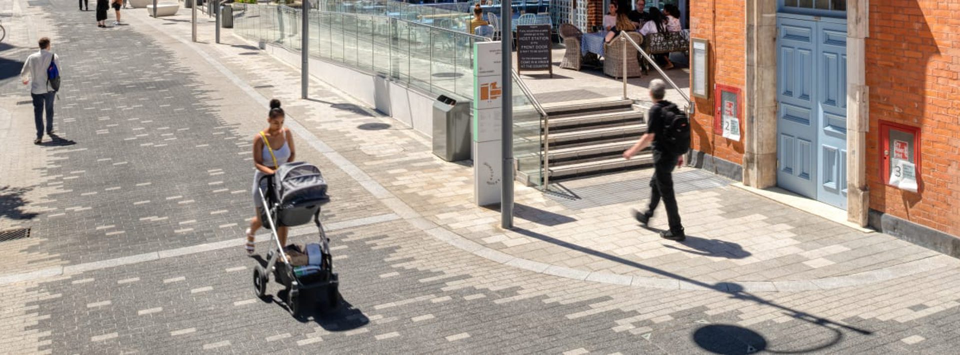 Members of the public walking in Islington square