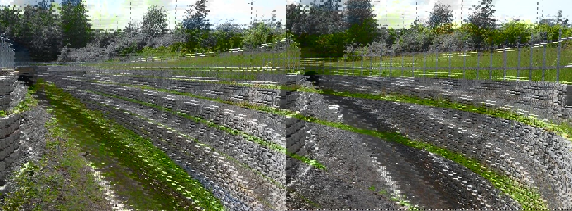 Marshalls Redi Rock flood walls alongside a stream